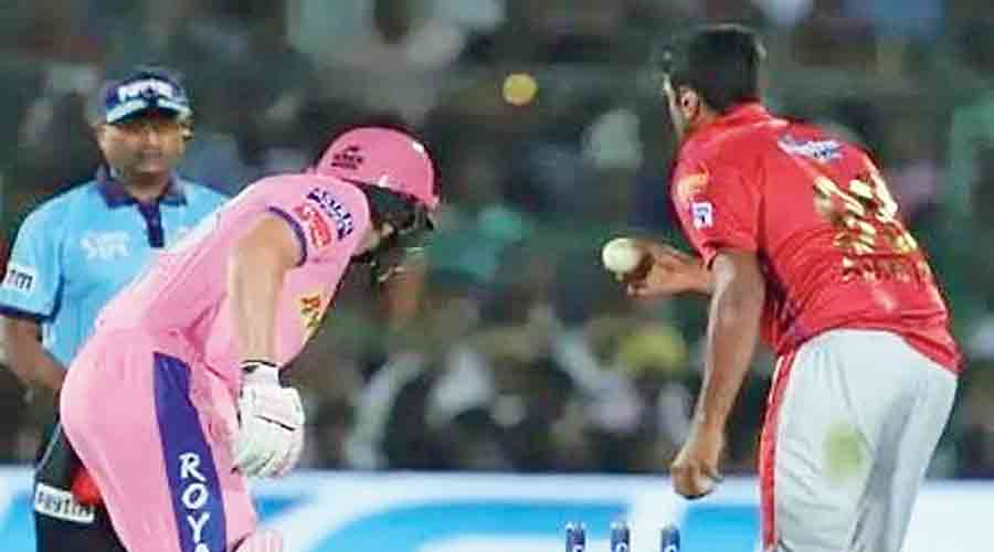 Ashwin running out Jos Buttler (left) after spotting he had left his crease before the ball had been delivered during an IPL match in 2019.