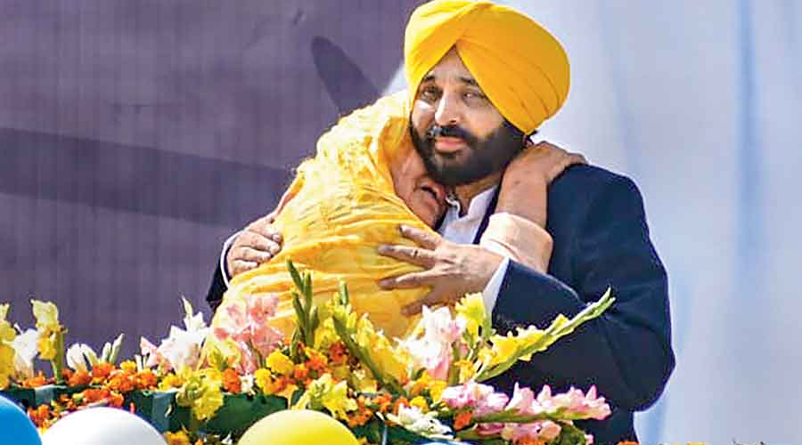 The AAP chief minister-designate, Bhagwant Mann, celebrates the party’s victory in the Punjab Assembly elections in Sangrur on Thursday.