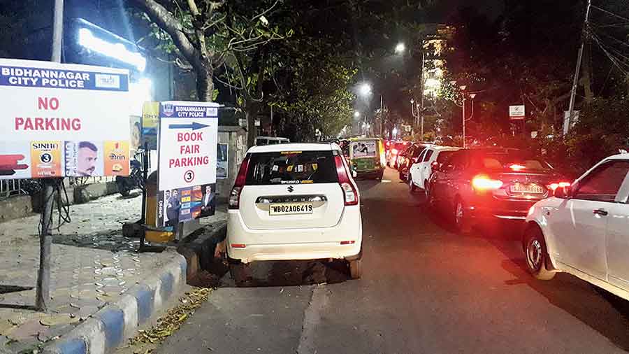 Cars parked in a no-parking zone in CJ Block as vehicles stand bumper to bumper on Saturday evening. 