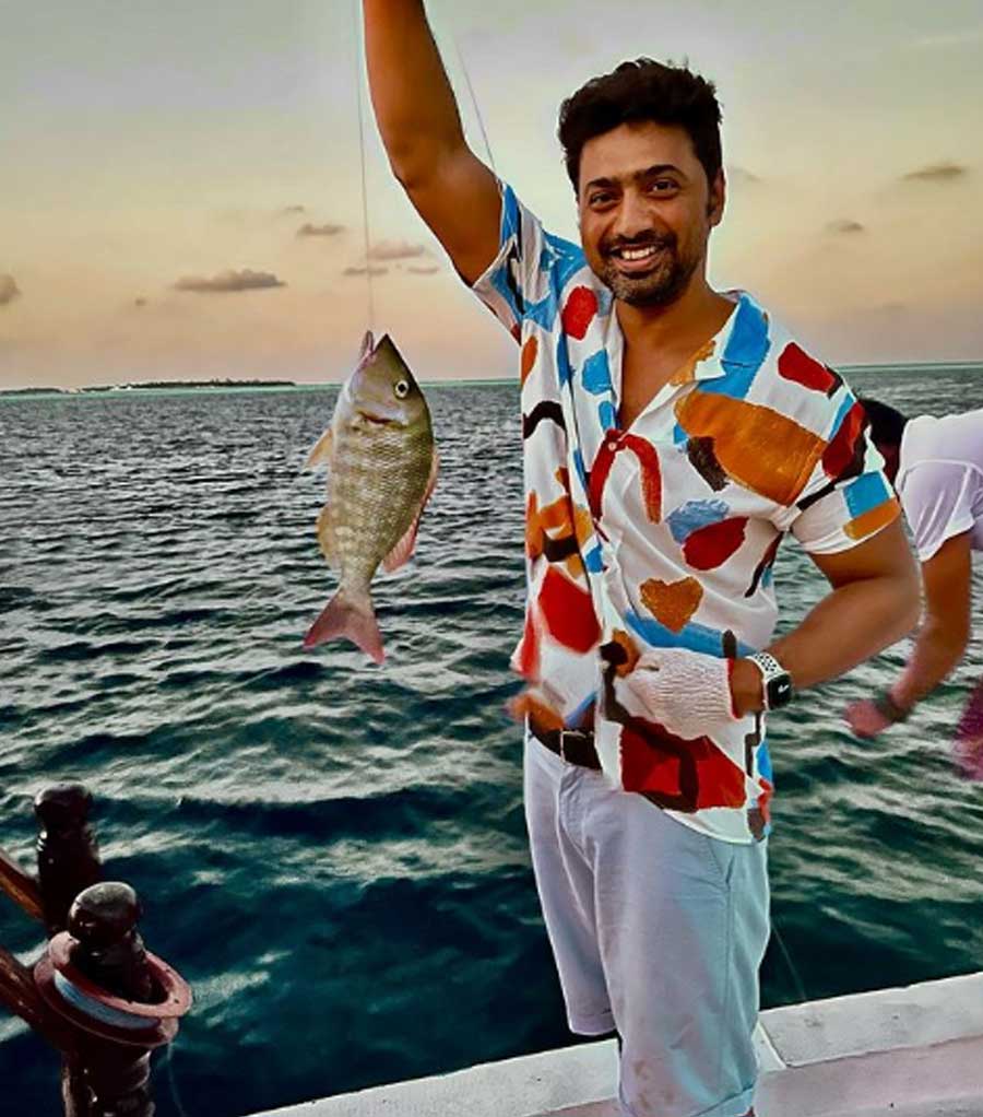 FISHY AFFAIR: Actor-turned-politician Dev poses with a fish he netted in the Maldives. The actor posted this photograph on Instagram on Tuesday, March 8, with the caption: "Fishing time….✌🏻 Fish was again dropped back into the Ocean 🌊"