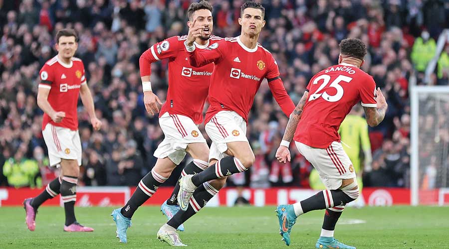 Cristiano Ronaldo (third from left) celebrates with teammates after scoring Manchester United’s first goal against Tottenham Hotspur at Old Trafford on Saturday. 