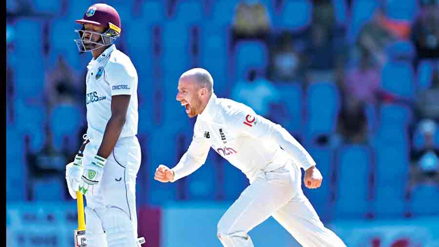 Jack Leach (right) celebrates after dismissing John Campbell of the West Indies on Day V of the first Test.