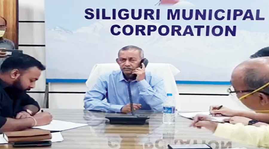 Siliguri mayor Gautam Deb takes a phone call from  a resident on Saturday.