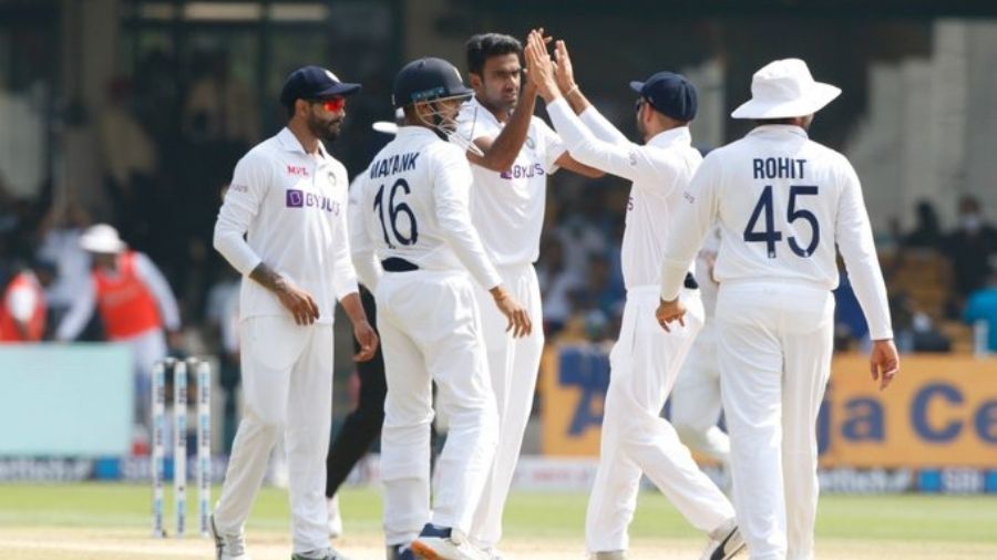 Indian team celebrates a fall of wicket, at the Chinnaswamy Stadium in Bangalore.