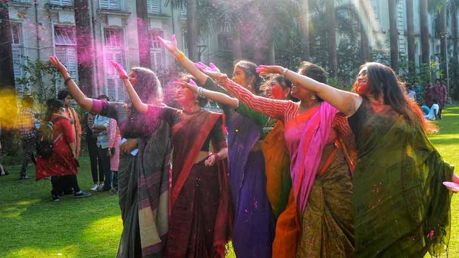 Students play with colours in a pre-Doljatra/ Holi event on the Presidency University basketball court on Tuesday. 