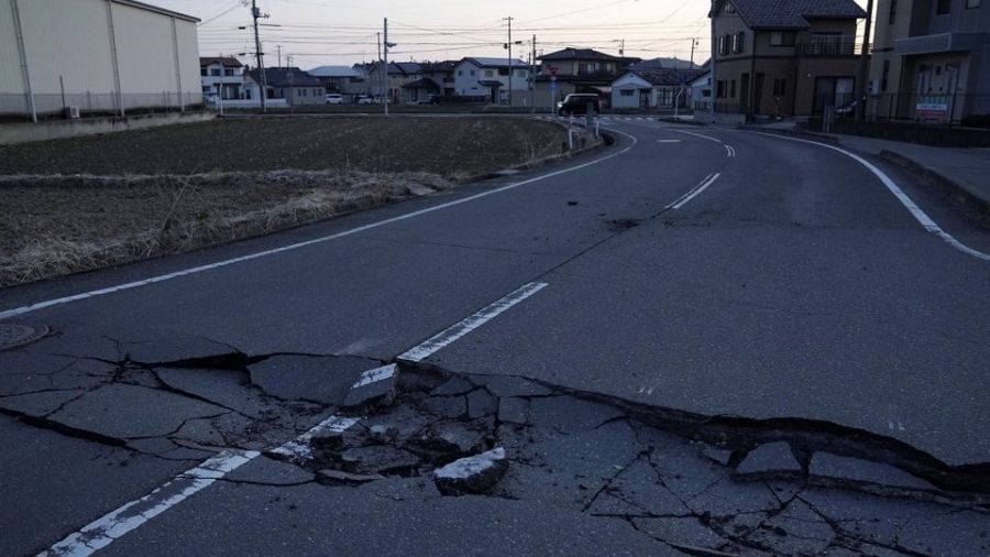 A broken road following a strong earthquake is pictured in Soma, Fukushima prefecture, Japan.