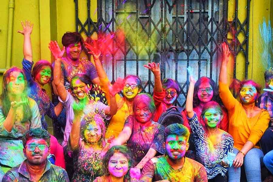 Jadavpur University students play with colours in a pre-Doljatra/ Holi event on Wednesday