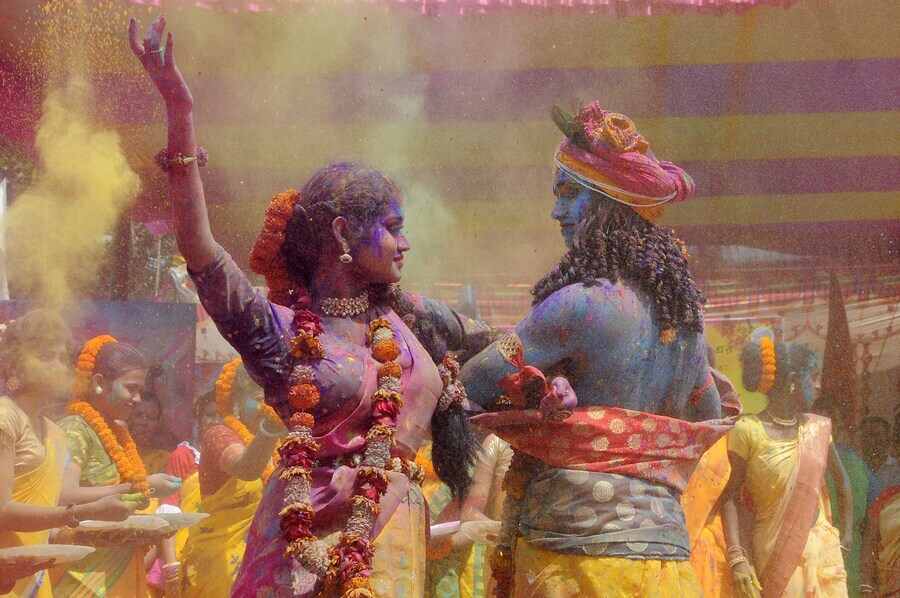 Youth dressed as Radha and Krishna dance at a spring festival in Bidhannagar on Thursday