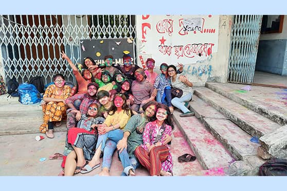 Caption: Abir-smeared from top to toe, students of the Sociology department of Jadavpur University pose for a post-celebration group photo.