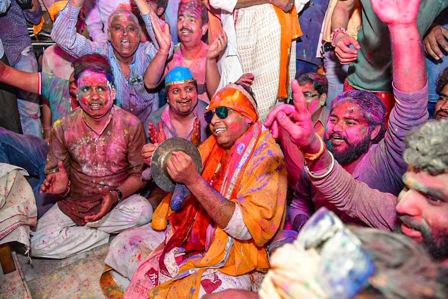 Newly-elected BJP MLA Srikant Sharma with others celebrate the festival of Holi, in Mathura.