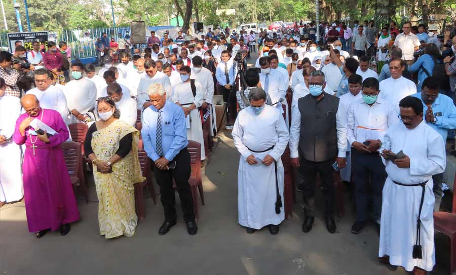 PACIFISTS ON STREET: Members of the Bengal Christian Council and others pray for world peace near the Gandhi statue on Mayo Road on Wednesday, March 16. Participants at the meeting condemned the ongoing Russian invasion of Ukraine and called for cessation of hostilities immediately 