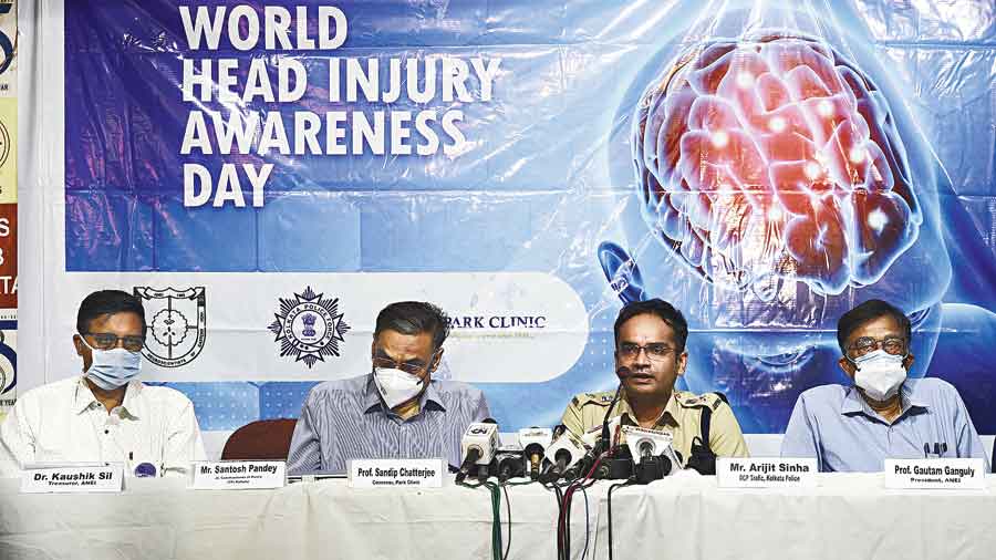 (From left) Kaushik Sil of the Association of Neuroscientists of Eastern India; Sandip Chatterjee, head of the neurosurgery department of Park Clinic, Kolkata; Arijit Sinha, deputy police commissioner of traffic; and Gautam Ganguly, president of the association and the head of department at Bangur Institute of Neurology (BIN); speak on the importance of wearing helmets on the eve of World Head Injury Awareness Day on Saturday. Picture by Sanat Kr Sinha