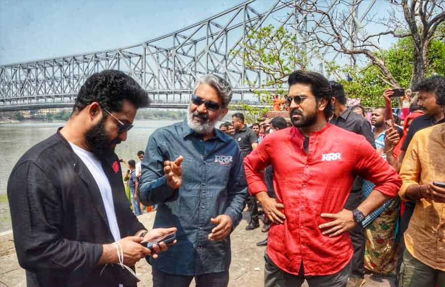 (From left) Telegu actor Jr NTR, director S.S. Rajamouli and actor Ram Charan at a promotional event for their upcoming movie 'RRR' in Kolkata on Tuesday. The action-packed period drama will hit the theatres on Friday this week