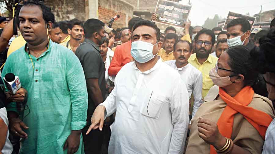Suvendu Adhikari (wearing mask) at Bogtui on Wednesday.
