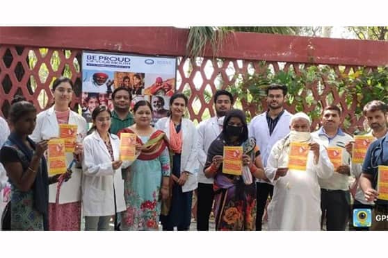 Faculty members and resident doctors with patients at World Oral Health Day at AMU.  