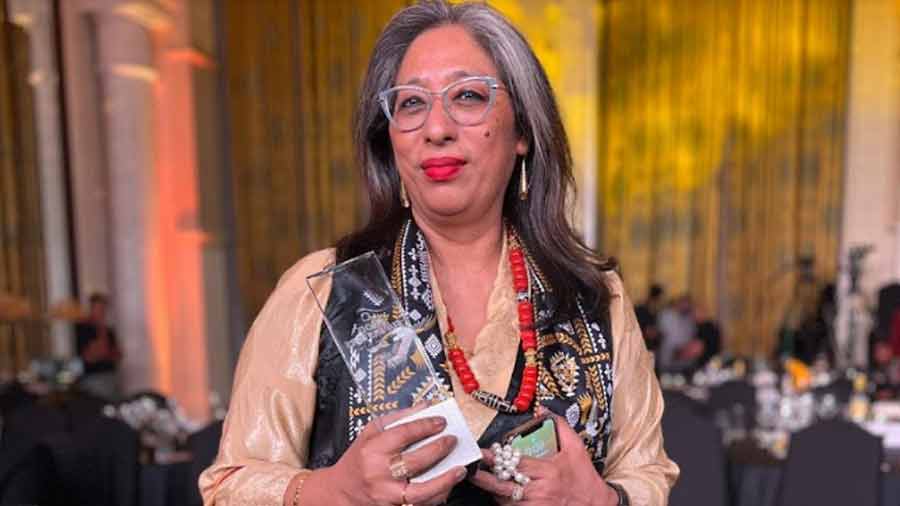 Doma Wang, the ‘Momo Queen’ of Kolkata, with her Food Superstars award  