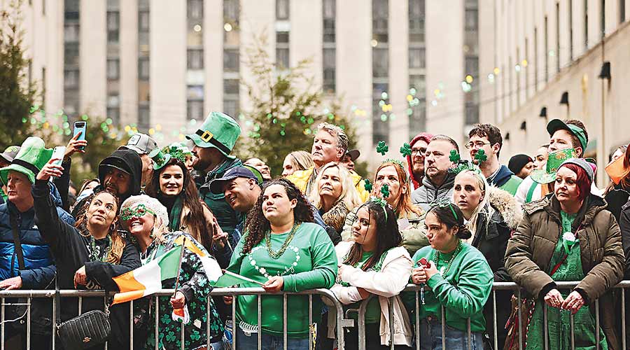People watch the Saint Patrick’s Day Parade on 5th Avenue, in the Manhattan borough of New York City, New York, U.S., March 17, 2022.