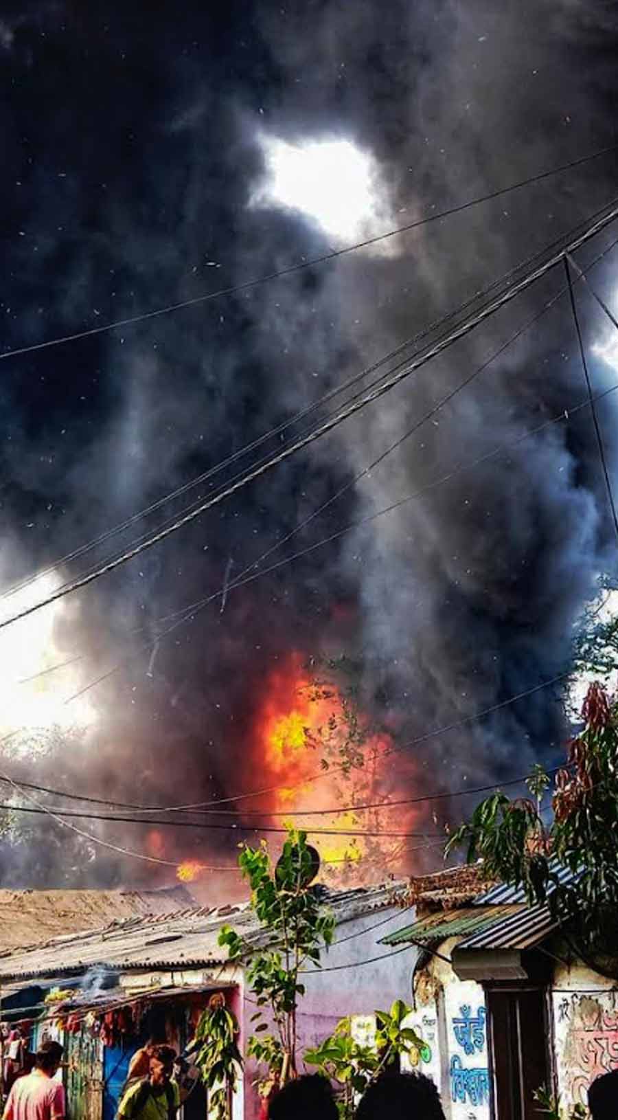 FACTORY BLAZE: Smoke billows from a paint factory on Chetla Road where a huge fire broke out on Tuesday, March 22. Ten fire tenders were pressed into action. The factory allegedly contained inflammable articles and was gutted by the time the fire could be extinguished