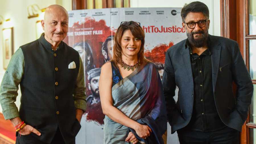 Actors Anupam Kher and Pallavi Joshi with film director Vivek Agnihotri during a press conference in New Delhi