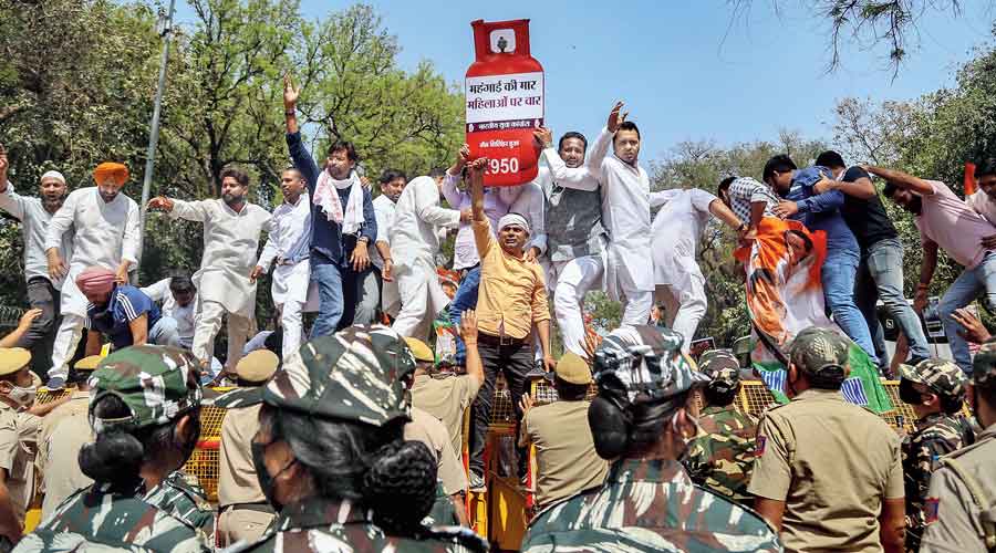 Indian Youth Congress members protest in Delhi on Saturday against the rise in prices of petrol, diesel, cooking gas and other essential commodities.