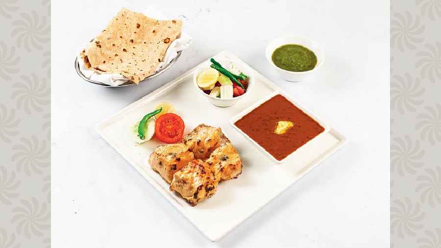 If you are craving desi khana, just call for Ajwaini Machali Tikka signature kebab box that has fresh bekti marinated with gram flour and ajwain batter and char grilled. This is accompanied by Mutter Pulao or Laccha Paratha.