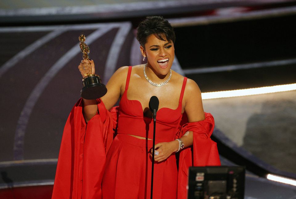 Ariana DeBose accepts the Oscar for Best Supporting Actress for her role in West Side Story.