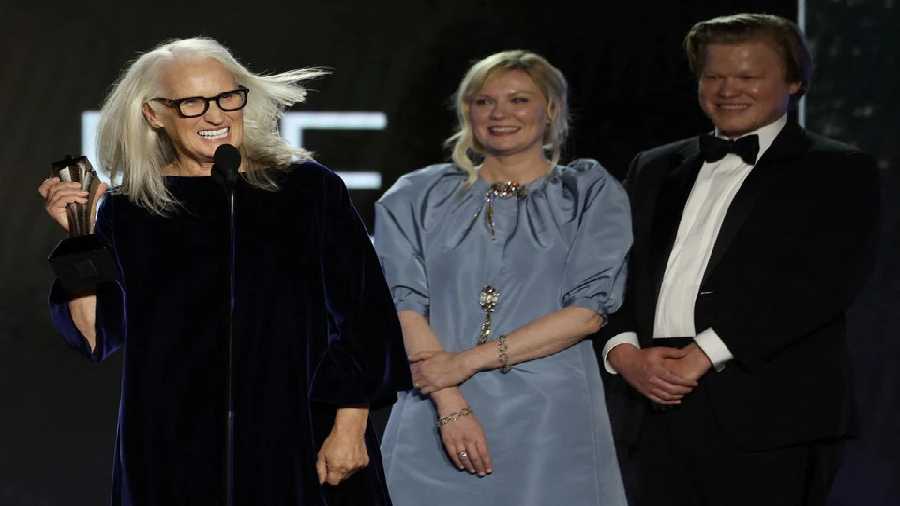 Director Jane Campion with cast members Kirsten Dunst and Jesse Plemons accept the award for Best Picture for The Power of the Dog.