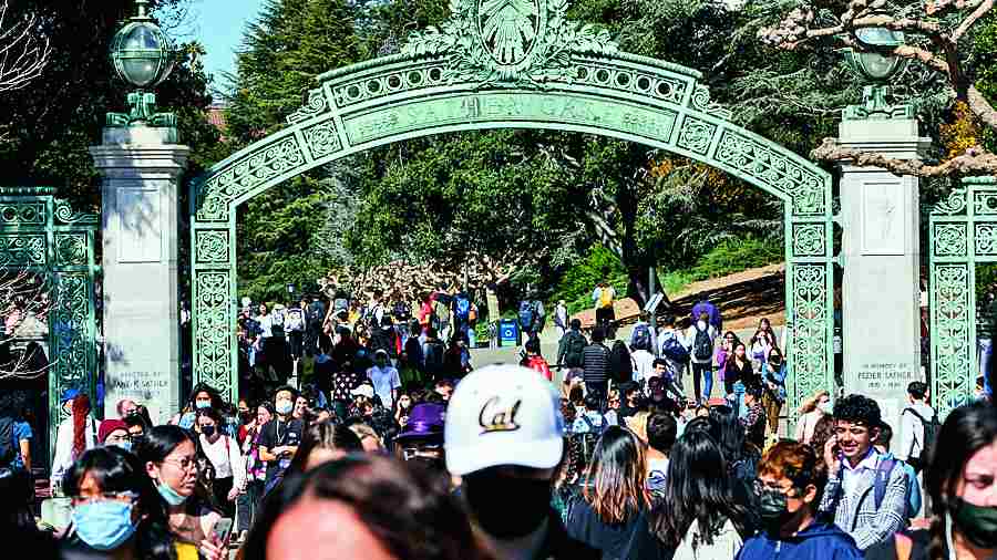 Students walk through the Sather Gate of the campus