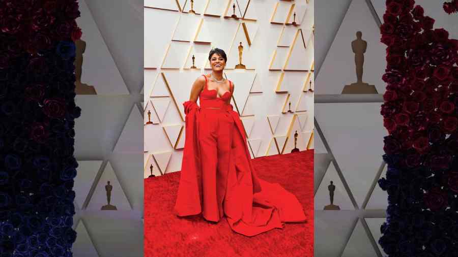 All eyes were on Ariana DeBose, who has been creating a buzz this award season. Oozing confidence, the actor blended classy cool in a classic red ensemble — wide-legged pants, a bodice with a plunging neckline and a cape wrapped around her hands. Chunky diamonds and kohl-rimmed eyes made her stand out.
