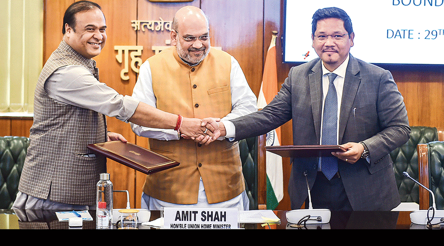 Assam chief minister Himanta Biswa Sarma (left) and Meghalaya chief minister Conrad Sangma shake hands after signing the border agreement in Union home minister Amit Shah's presence in New Delhi on Tuesday.