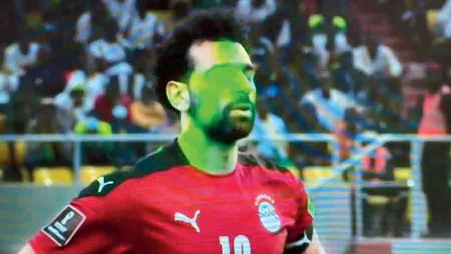 Lasers smudge Mohamed Salah’s face during the World Cup qualifying match against Senegal in  Dakar.