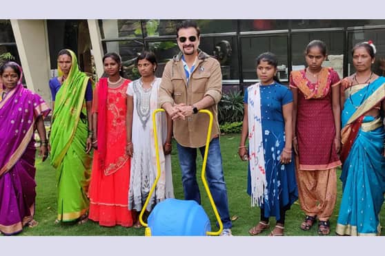 Sanjay Kapoor with the water wheel.