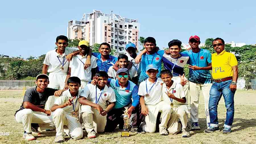 Mainland Sambaran Cricket Academy players and support staff after winning the  inaugural Mantoo Ghosh Challenge Cup