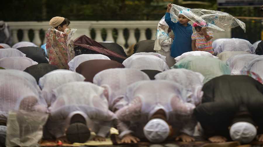 Muslim offer prayers amid rains