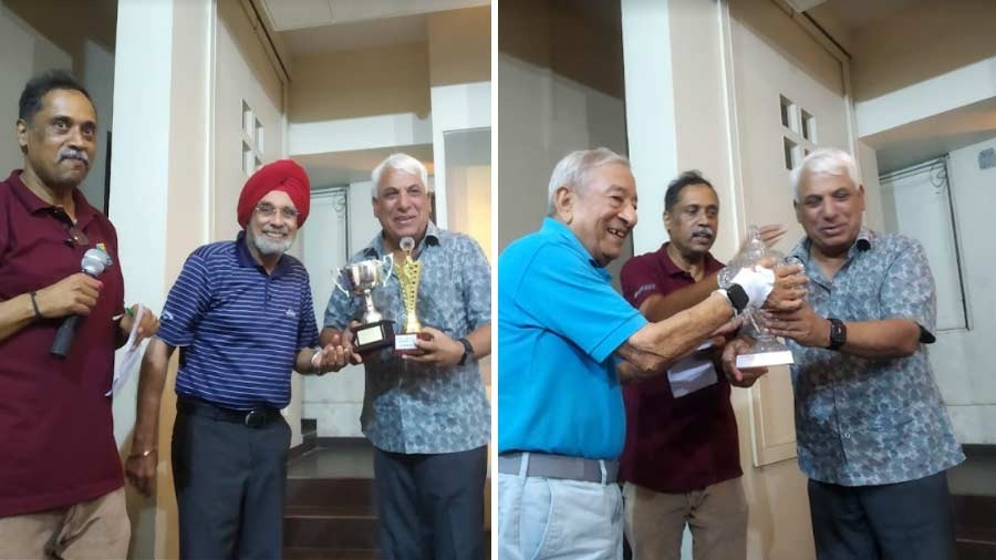 Arun Singh and Om Kaul with their respective trophies
