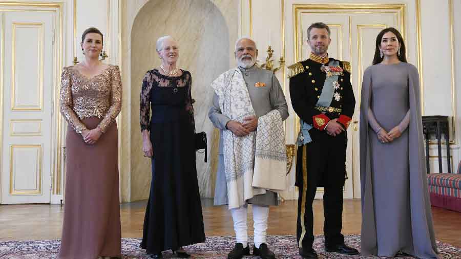 With Queen Margaret II (On his right)