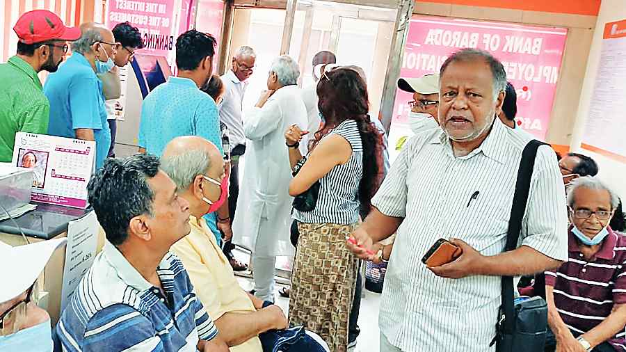 Elderly residents gathered at the bank last Saturday 