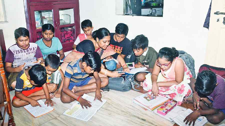 Rupa Chakraborty tutoring a batch in her BL Block home before the pandemic. 