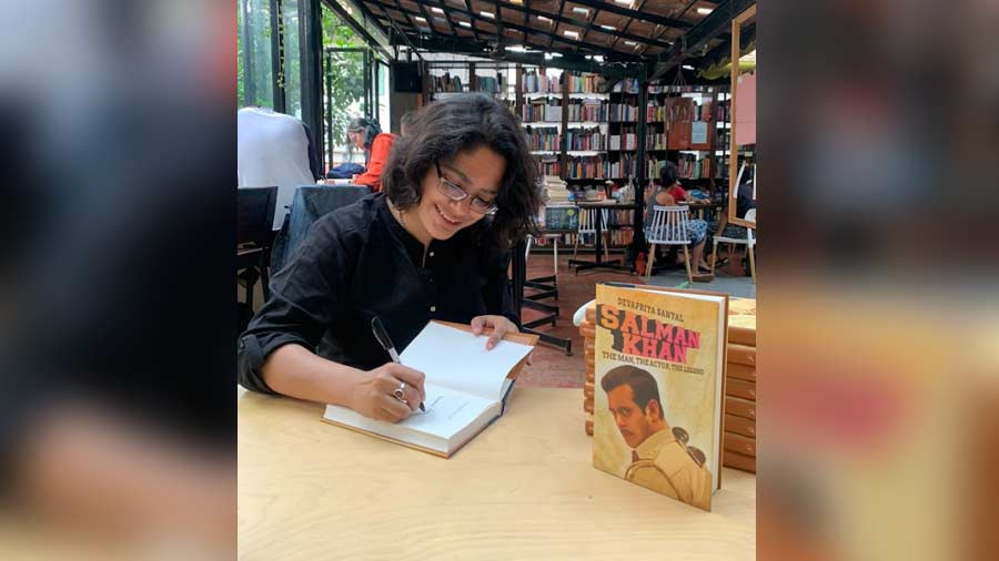 The author signing copies of her book