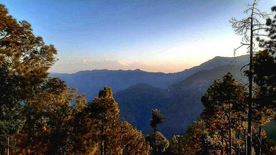 On a clear day, visitors are treated to a view of the snowy peaks of Nanda Devi, Trishul and other massifs of the Garhwal-Kumaon Himalayan range