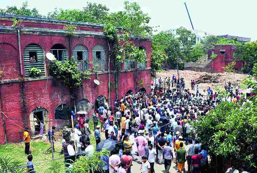 A crowd gathers in front of the Cossipore building where Arjun Chowrasia was found hanging on Friday.