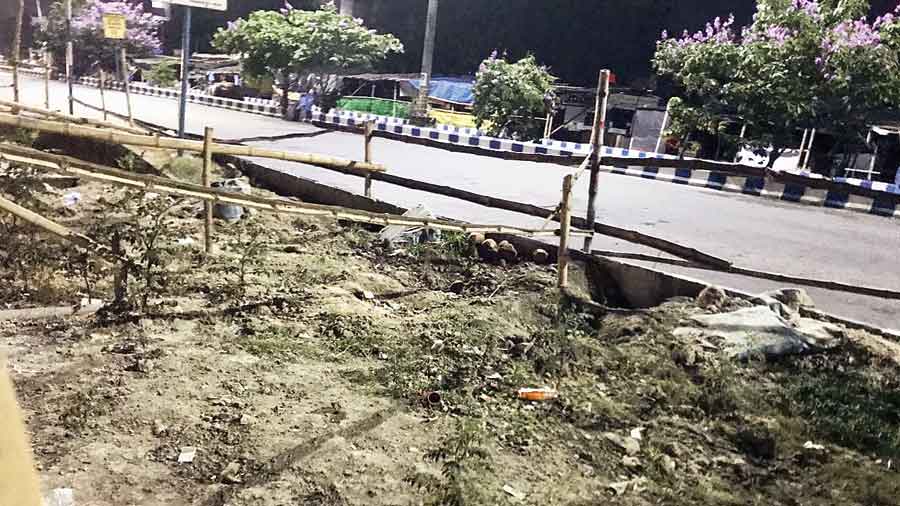 A caved-in stretch of road in front of DLF New Town Heights