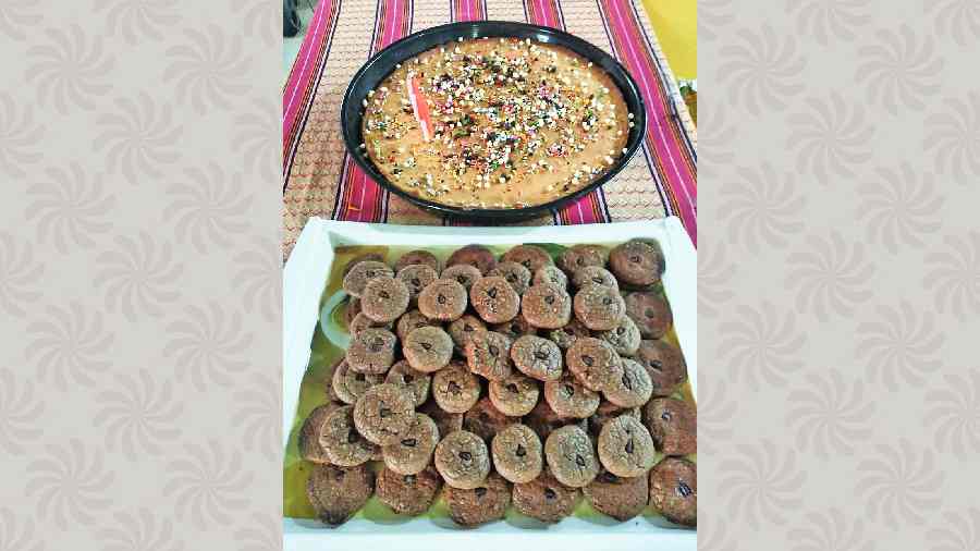 A cake and cookies made by trainees at Behala Bodhayan