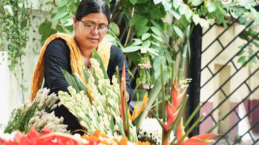 Putul Das at her flower stall at Hindustan Park on Sunday. 