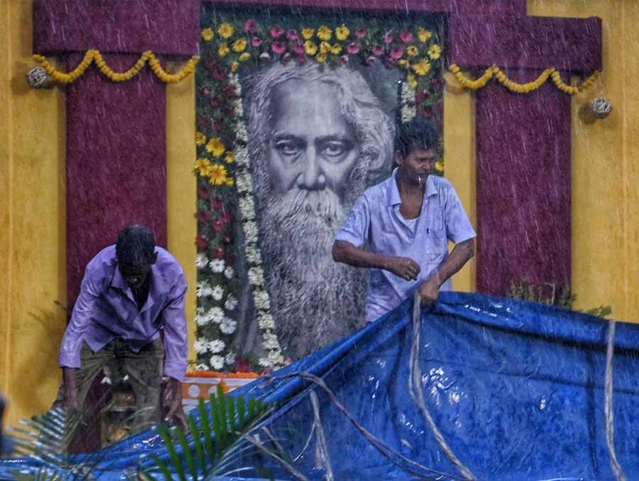 Southern Avenue: The decorators made a dash to cover up the stage, erected to host a cultural programme of a south Kolkata school on the occasion of Rabindra Jayanti, with polythene sheets in a jiffy. 