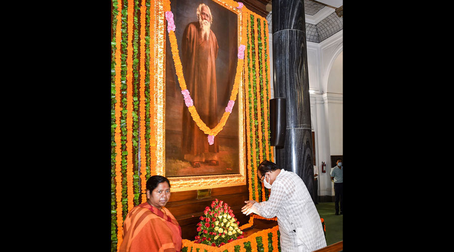 TMC leader Sukhendu Sekhar Roy pays floral tribute to Nobel laureate Rabindranath Tagore on his 161st birth anniversary, at Central Hall of Parliament House, in New Delhi.