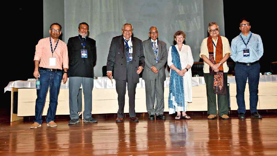 (From left) Gautam Bhattacharyya, Subir Sarkar, Bikash Sinha, MK Narayanan, Barbara Wickham Obe, Sibaji  Raha and Sumit Som at the Saha Institute of Nuclear  Physics on Monday. 