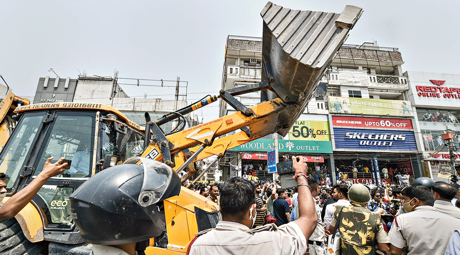 A bulldozer in the vicinity  of Shaheen Bagh on  Monday.