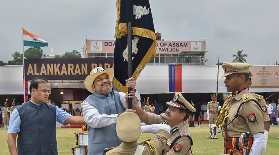 Union Home Minister Amit Shah presents the prestigious President’s Colours to the Assam Police, in Guwahati, Tuesday, May 10, 2022. Assam CM Himanta Biswa Sarma is also seen. 