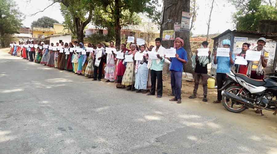 Villagers form the human chain at Latehar in Jharkhand on Wednesday. 